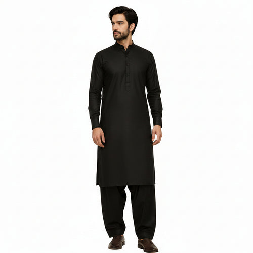 Man wearing a traditional BLACK 
kurta with pants against a plain background
